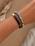 Lot de 2 bracelets élastiques – Perles plates blanc, noir & touches dorées