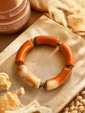 Bracelet élastique perles incurvées terracotta & marron
